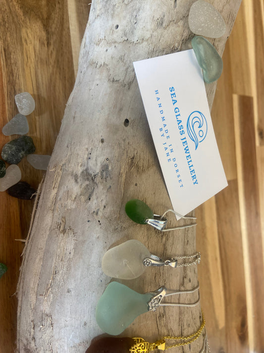 Simple drilled pendant with pinch bail on silver plated chain