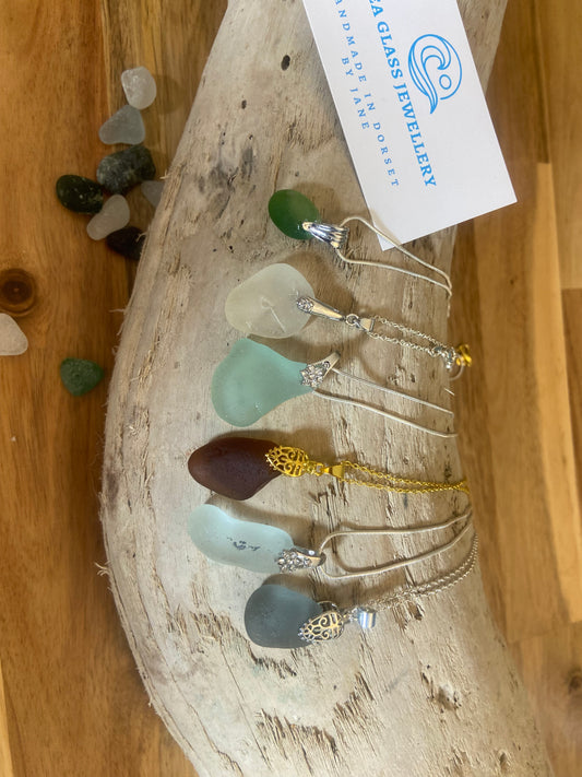 Simple drilled pendant with pinch bail on silver plated chain